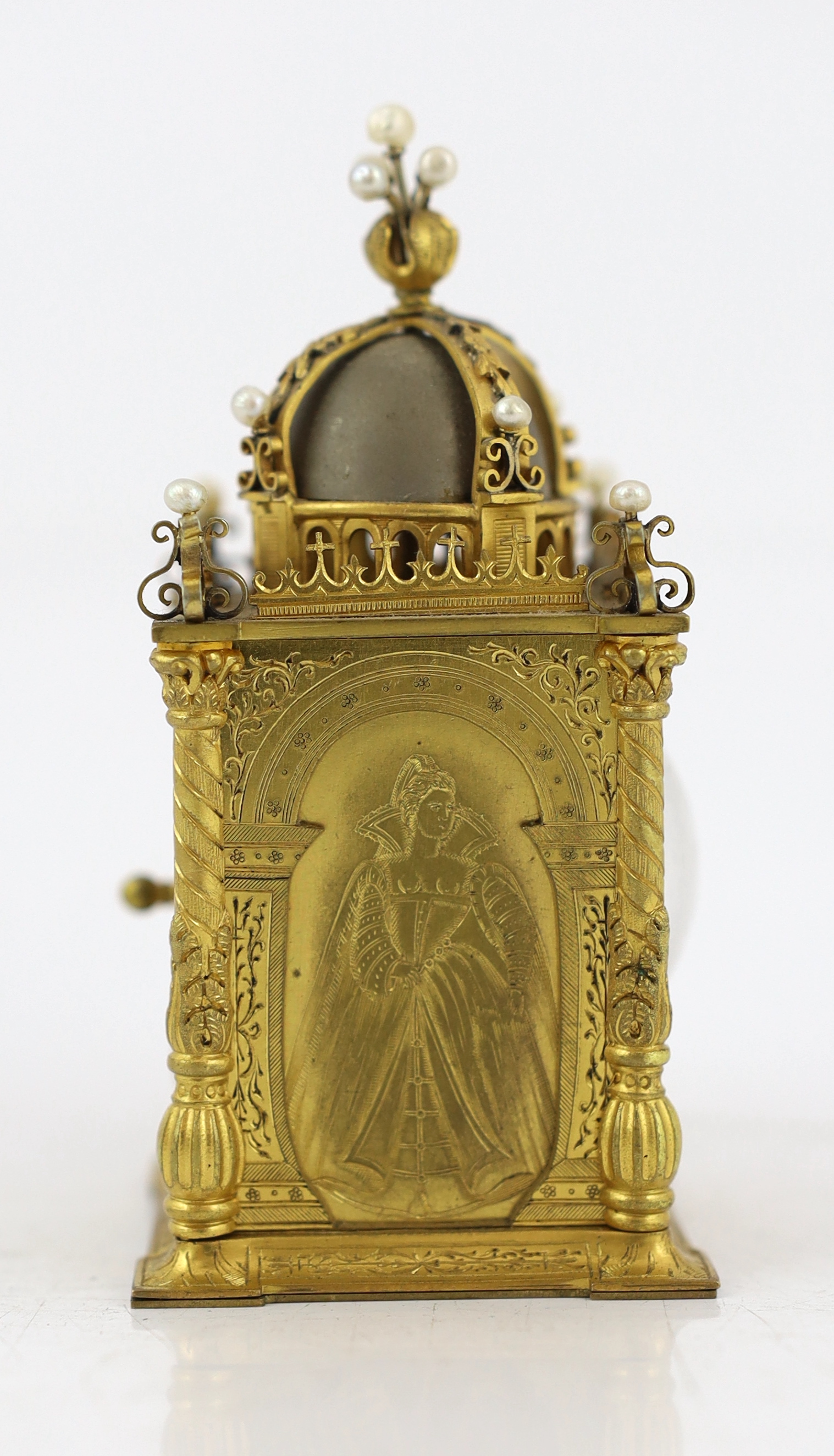 An early 20th century French miniature timepiece modelled on a 17th century domed bell clock, 4.75cm wide, 9.5cm high, with original leather travelling case